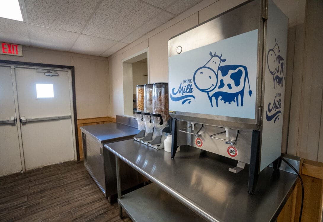 Snacks and breakfast station at the CHH Pecos Lodge with cereals and milk vending machines