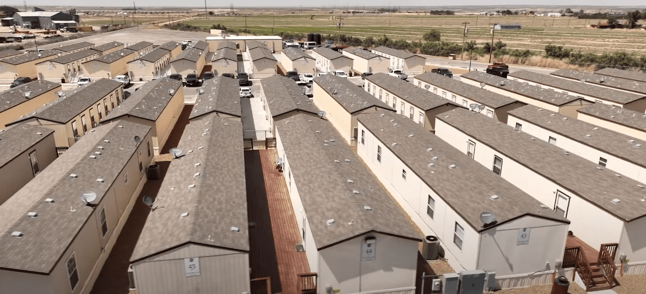 Aerial shot of CHH Loving NM Lodge from the back of the units/compound