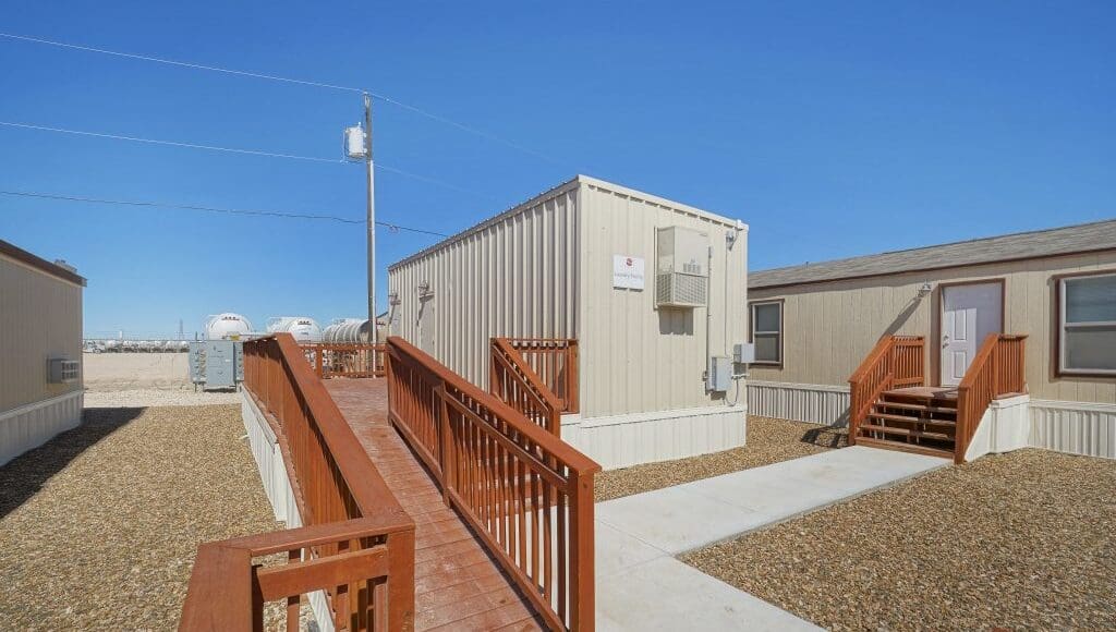 Outdoor shot of the units in CHH Odessa Lodge on a bright blue sky