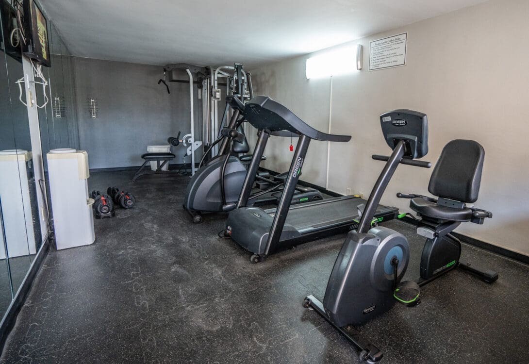 One side of the work out room in CHH Big Spring with gym equipments in it