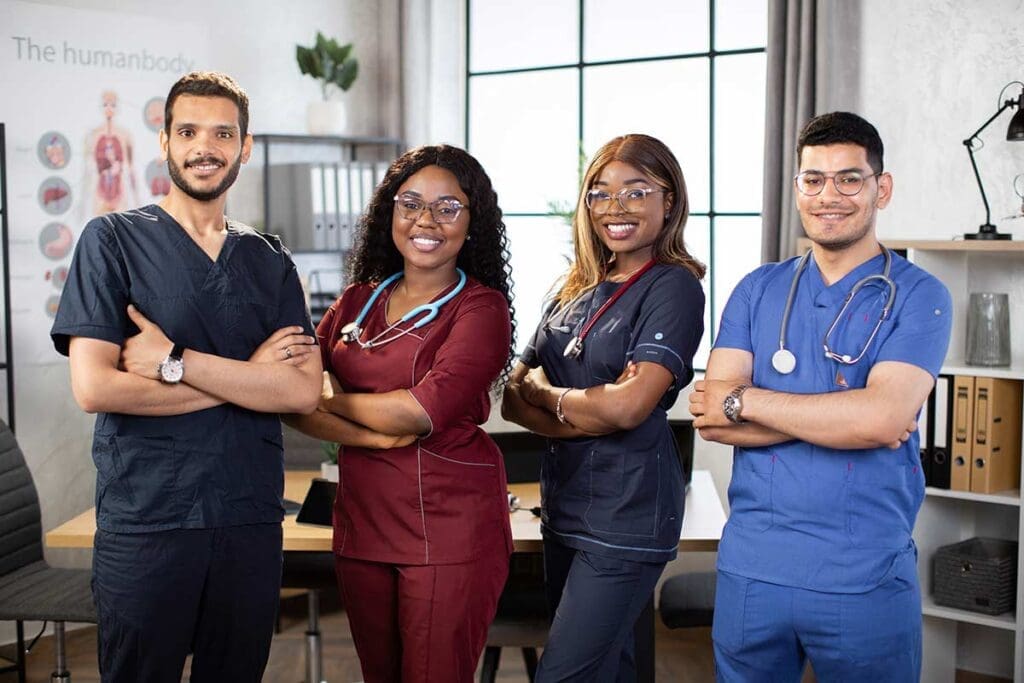 Two women and two men as health care professionals for CHS