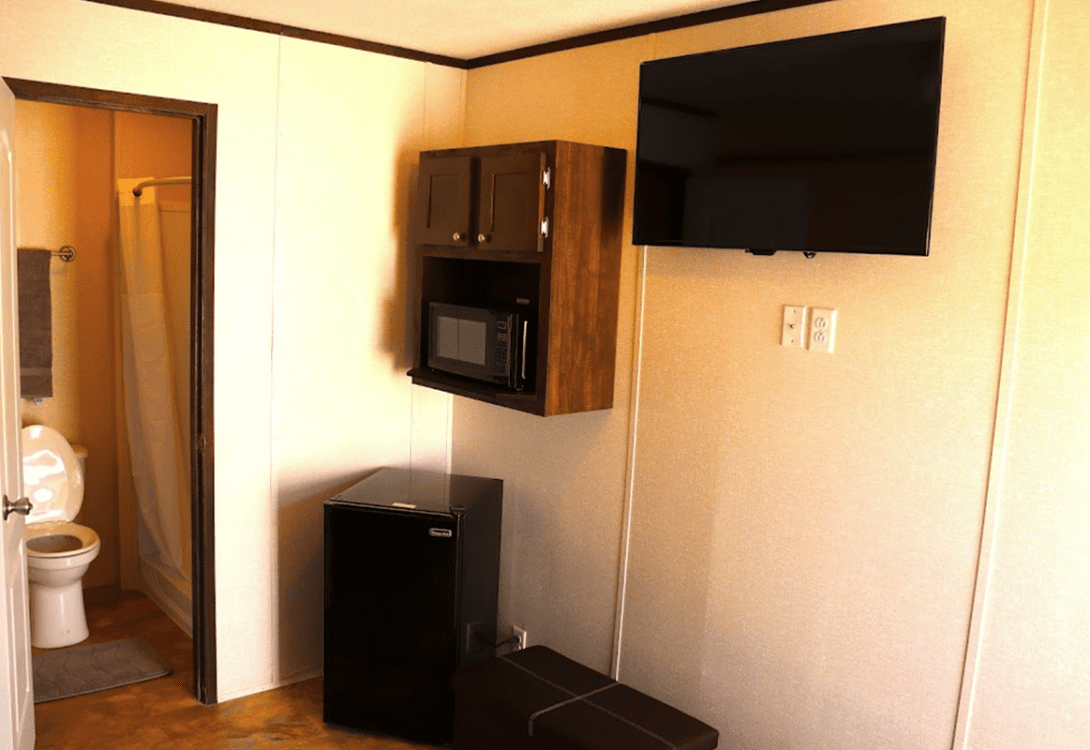 CHH Orla Lodge unit with a private bathroom, a mini ref, microwave and flat screen TV